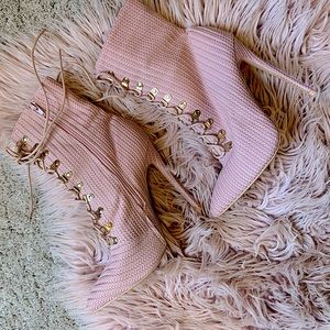 Pink lace-up heeled boots